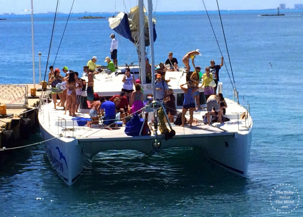 Tourists enjoying the open catamaran , Isla Mujeres