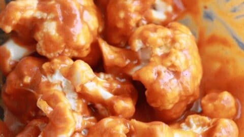 cauliflower florets coated with sauce