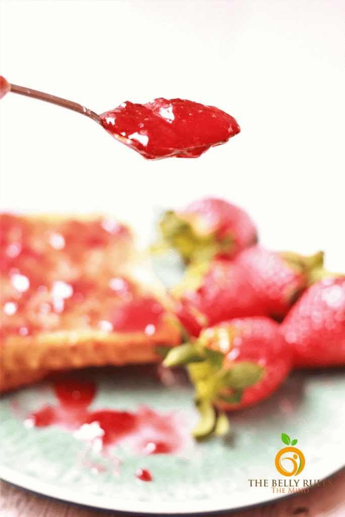 thick strawberry jam on a spoon