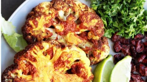 Combine the goodness of cauliflower, turmeric, garlic and an air fryer, you get these delicious Air Fryer Cauliflower Steaks.&nbsp;Super easy and ready in just 15 minutes. These crispy yet tender bites make an excellent plant based entree. Packed with all the flavors and textures, simply yum!!! #cauliflowersteak #cauliflowersteakrecipe #airfryercauliflowersteak #cauliflowerrecipe #airfryerrecipe #vegansteak #vegancauliflowerrecipe #veganairfryer #airfryersteak 