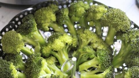 Steamed Broccoli is the healthiest and easiest way to consume broccoli. Here is how to steam broccoli perfectly (crispy tender) every time so that it retains it's green color and nutrients. Enhance the flavors with some garlic salt, pepper, butter and lemon juice and this makes a perfect side. Kid Approved. Vegan. Gluten-Free. #steamedbroccoli #steamedbroccolirecipe #instantpotbroccoli #mealthybroccoli #howlongtosteambroccoli