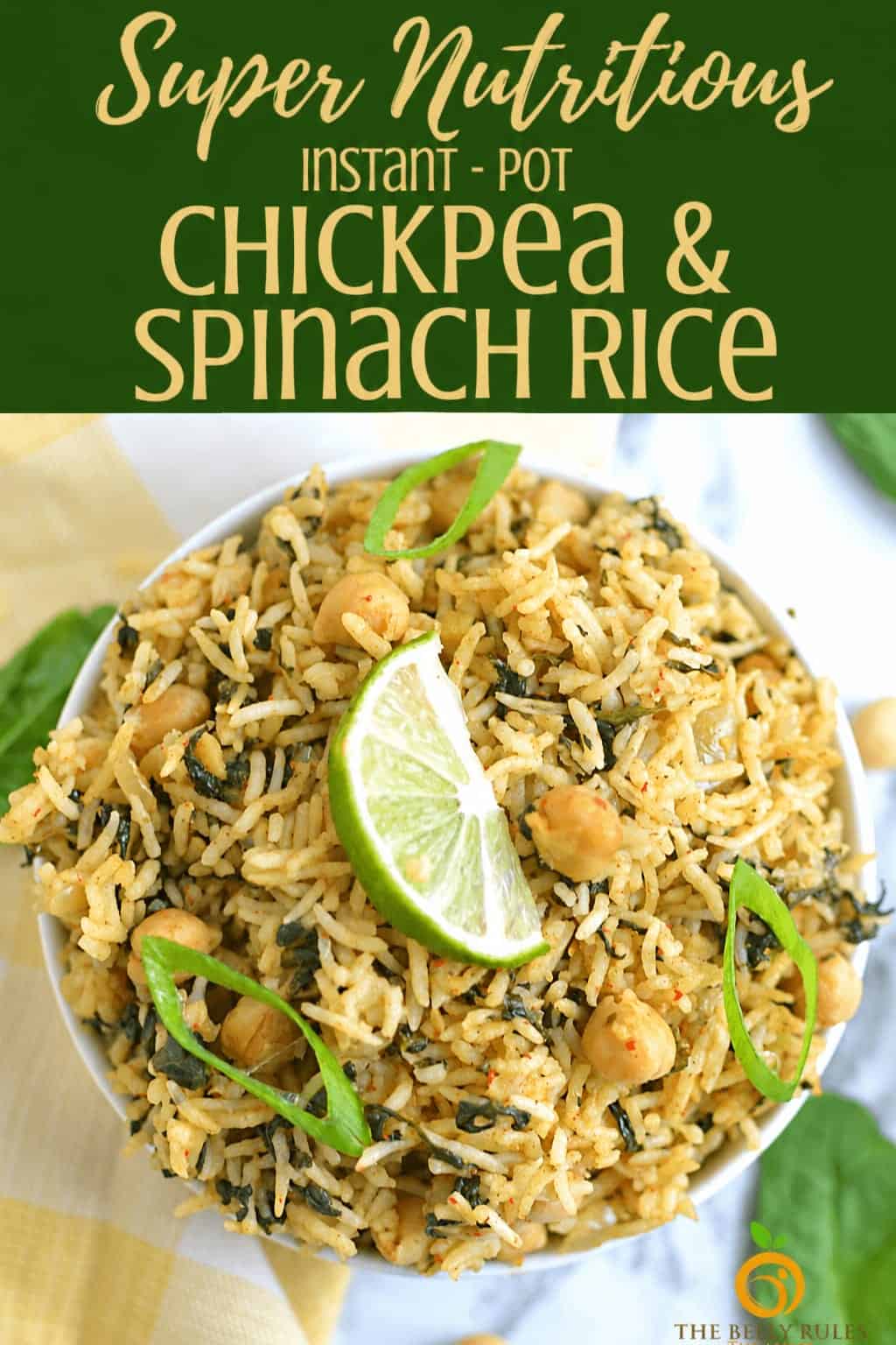 Delicious chickpea and spinach rice served with lime slices and green chilies.
