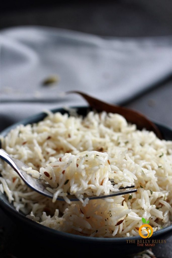 jeera rice or cumin rice on a fork