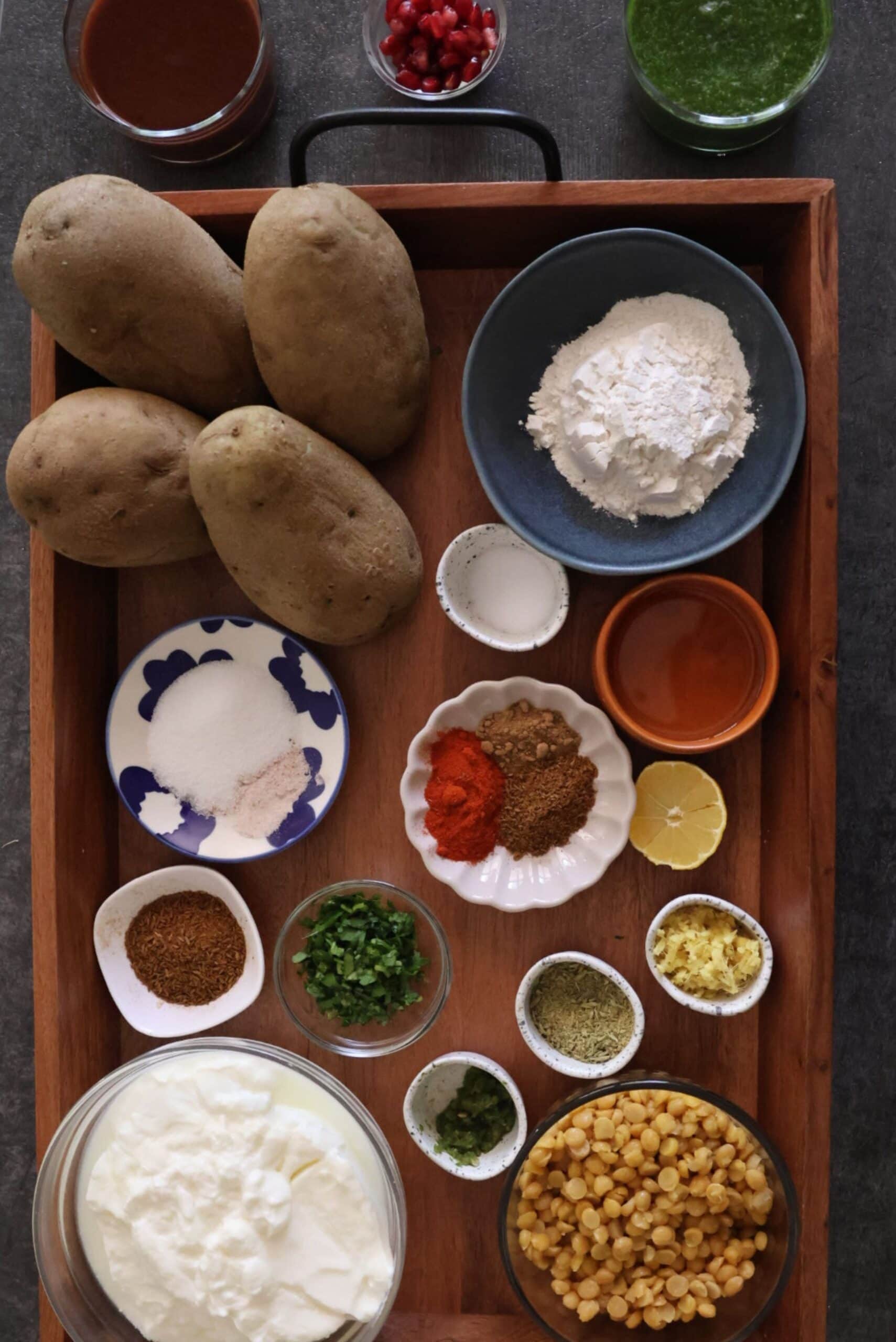 Aloo Tikki ingredients with spices, potatoes, and chickpeas for authentic Delhi chaat.