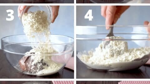 Bowl of chocolate cake batter with white chocolate chunks.
