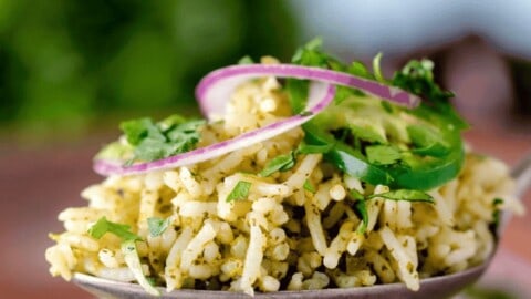 Delicious Mexican green rice with herbs and vegetables, perfect for flavorful meals.