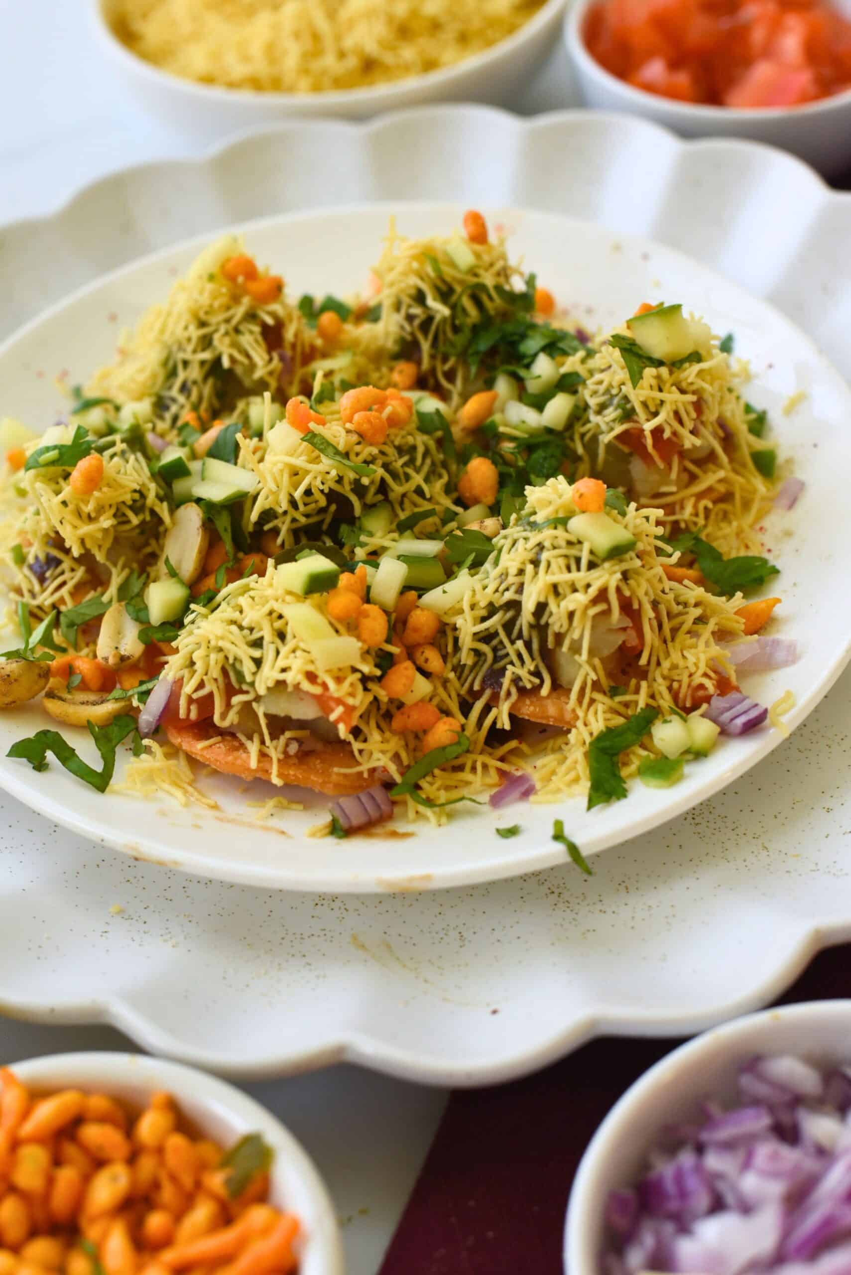 Sev Puri Indian street food with crunchy chickpea toppings and fresh vegetables.