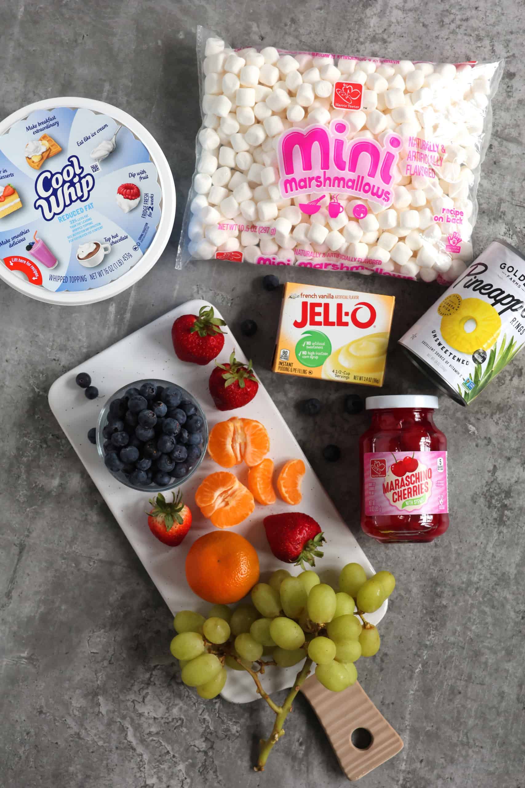 Ingredients to make an Ambrosia Fruit Salad with Cool Whip, Pudding and Mashmallows