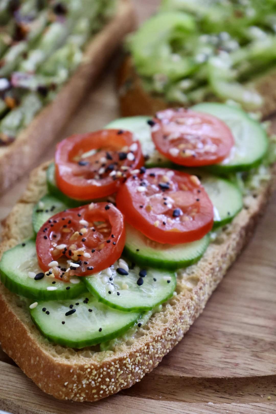 cucumber tomato avocado toast with everything bagel seasoning