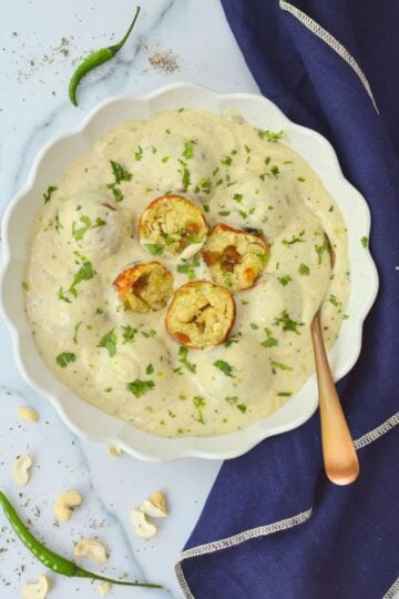 Stuffed Malai kofta made in silky white gravy