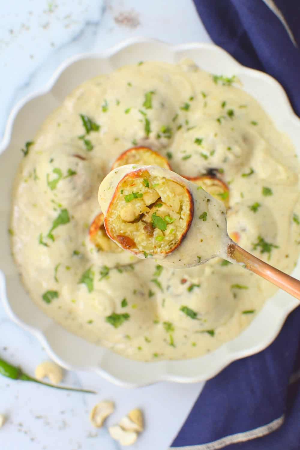 Stuffed Malai kofta made in silky white gravy
