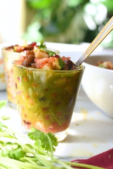 Delicious kala chana chaat served in a glass, highlighting nutritious ingredients and vibrant flavor.