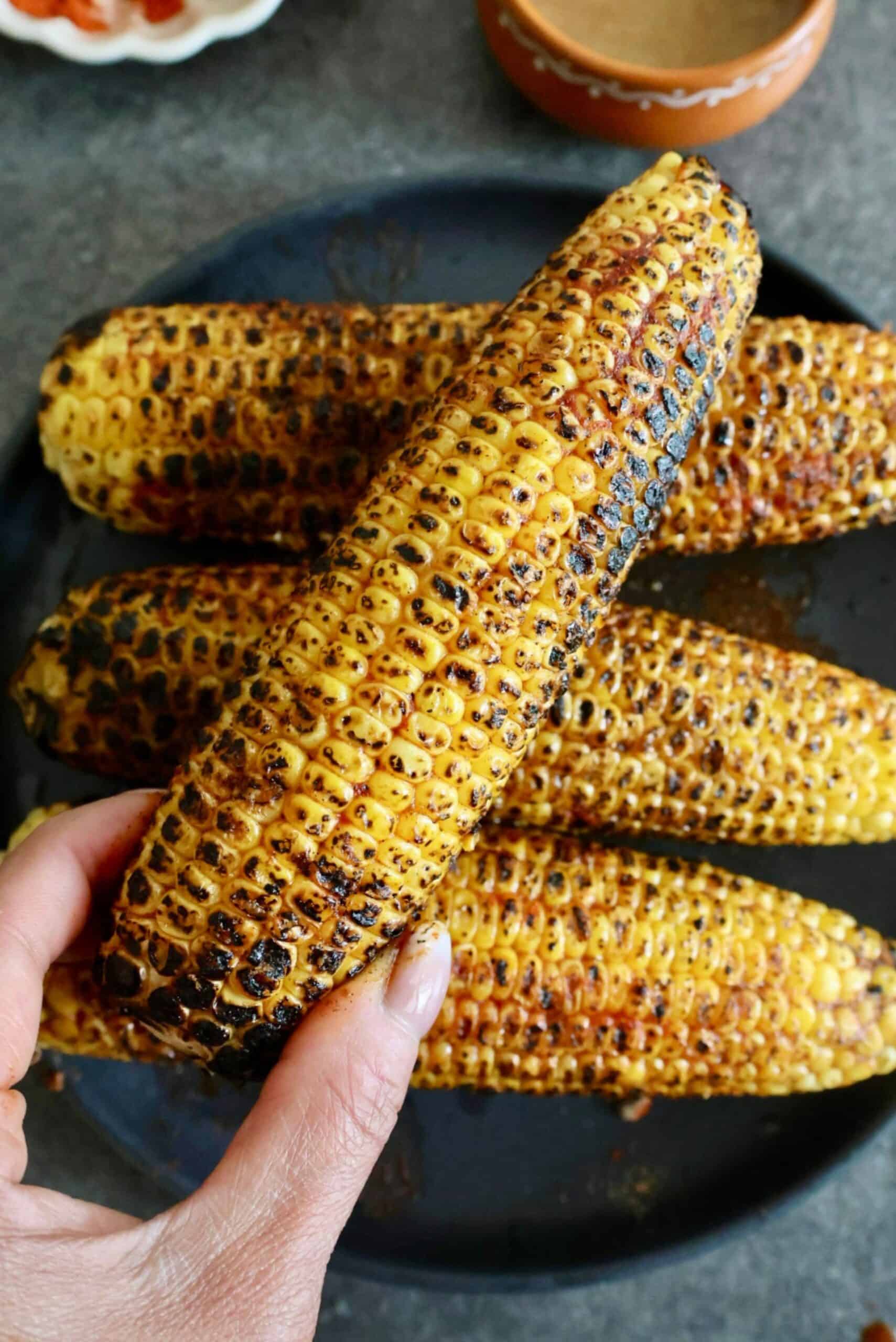 Delicious charred Indian-style corn on the cob, perfect for street food lovers.
